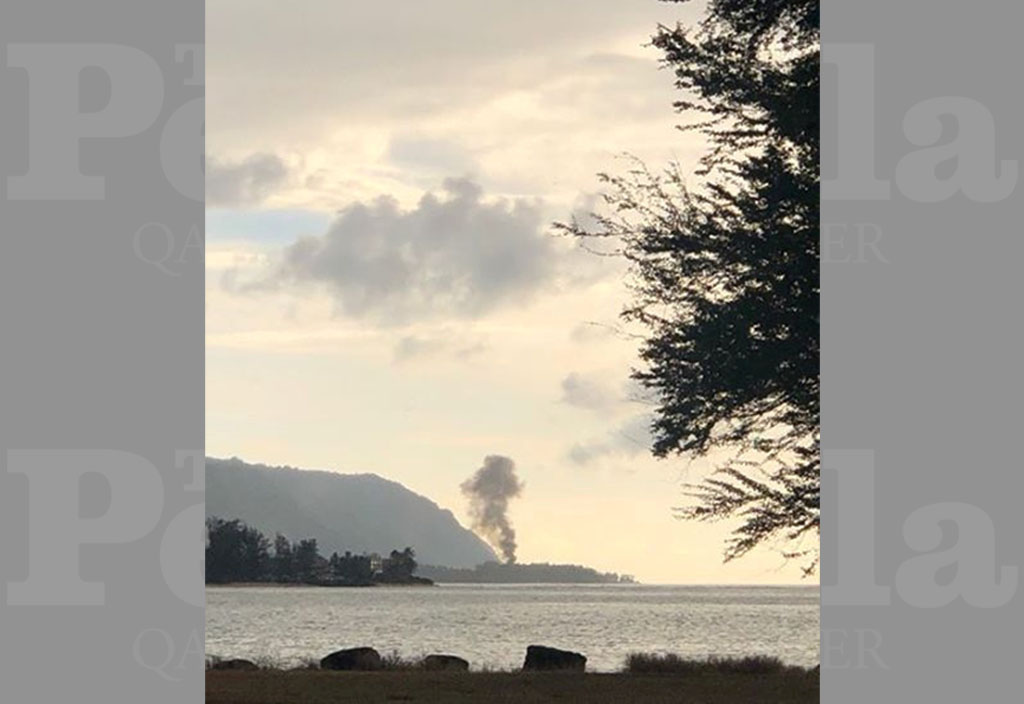 A plume of smoke rises after an airplane crash, seen from Kaiaka Bay Beach Park, in Haleiwa, Hawaii, U.S., June 21, 2019 in this image obtained from social media. LuckyWeLive.com via REUTERS 