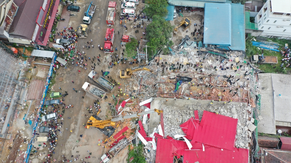 An overhead view of a collapsed under-construction building in Sihanoukville, Cambodia June 22, 2019. REUTERS