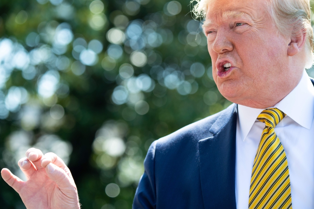 US President Donald Trump speaks to the media prior to departing on Marine One from the South Lawn of the White House in Washington, DC, June 22, 2019, as he travels to Camp David, Maryland. AFP / SAUL LOEB