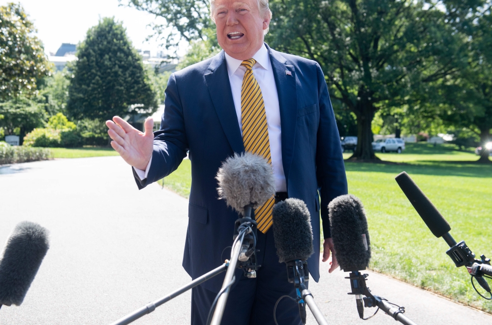 US President Donald Trump speaks to the media prior to departing on Marine One from the South Lawn of the White House in Washington, DC, June 22, 2019, as he travels to Camp David, Maryland. / AFP / SAUL LOEB