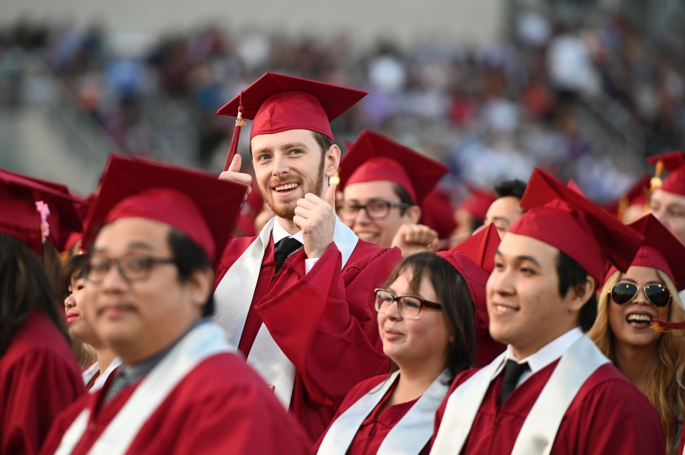 Students earning degrees at Pasadena City College participate in the graduation ceremony, June 14, 2019, in Pasadena, California.  AFP / Robyn Beck 