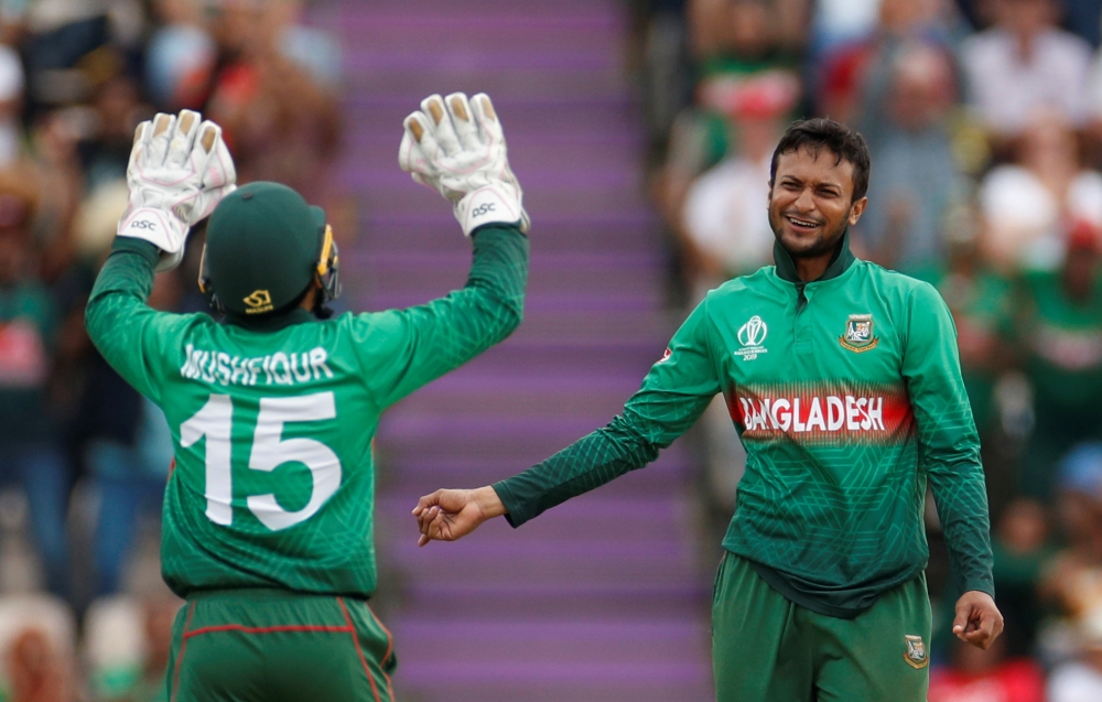  Bangladesh's Shakib Al Hasan and Mushfiqur Rahim celebrate taking the wicket of Afghanistan's Najibullah Zadran. Action Images via Reuters/John Sibley