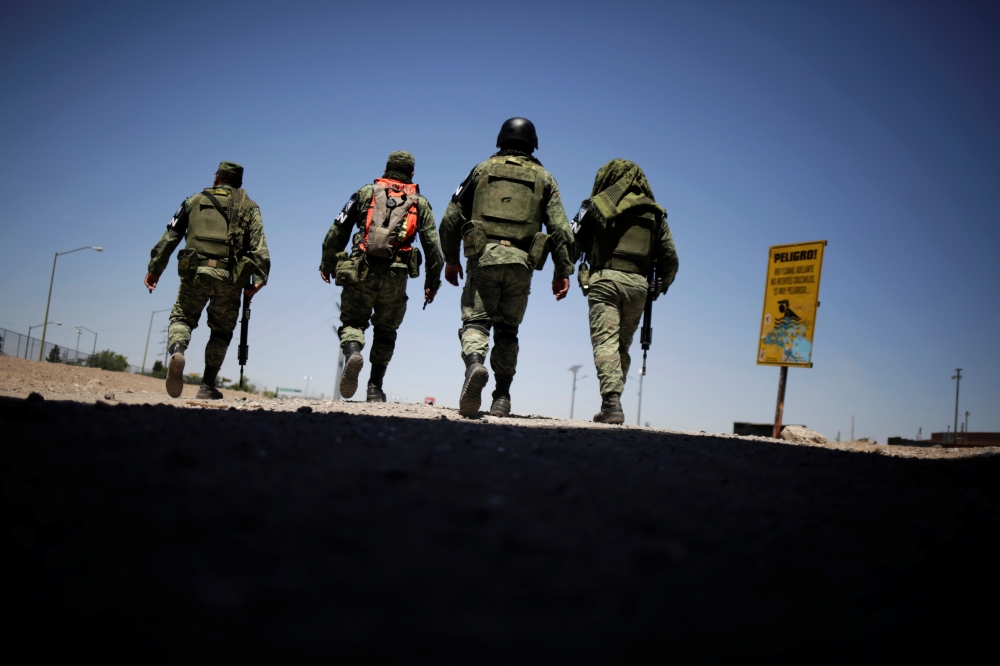 Members of Mexico's National Guard patrol the border between Mexico and the U.S. as part of an ongoing operation to prevent migrants from crossing illegally into the United States, in Ciudad Juarez, Mexico June 24, 2019. REUTERS/Jose Luis Gonzalez