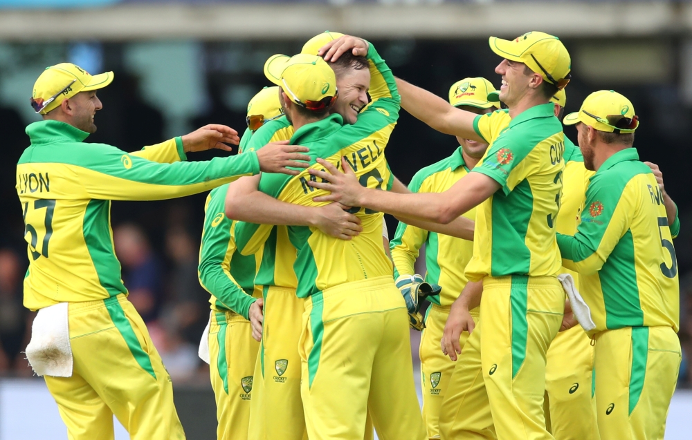 Australia's Jason Behrendorff celebrates with teammates after taking the wicket of England's Jofra Archer Action Images via Reuters/Peter Cziborra 