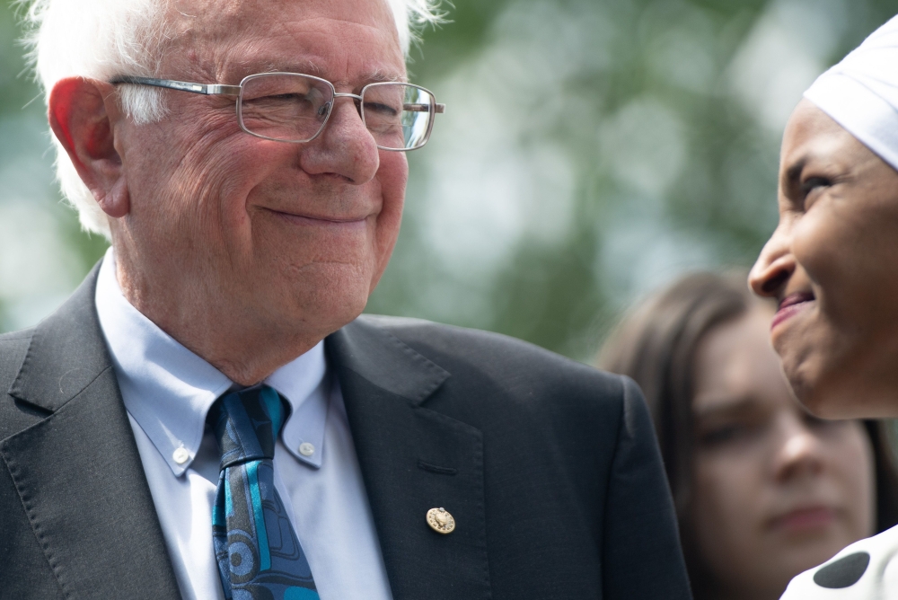 US Senator Bernie Sanders (L), Independent of Vermont, and Representative Ilhan Omar (R), Democrat of Minnesota, hold a press conference to introduce college affordability legislation outside the US Capitol in Washington, DC, June 24, 2019. AFP / SAUL LOE