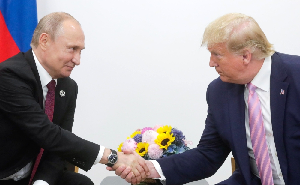 US President Donald Trump (R) meets Russian President Vladimir Putin (L) on the first day of the G20 summit in Osaka, Japan on June 28, 2019. (Kremlin Press Office/Anadolu Agency)