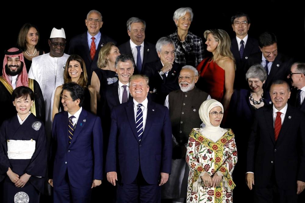 (Front row, LtoR) Japanese Prime Minister Shinzo Abe and his wife Akie, US President Donald Trump, the Turkish President's wife Emine Erdogan and Turkish President Recep Tayyip Erdogan, pose for a group photo of heads of state and their spouses before a c