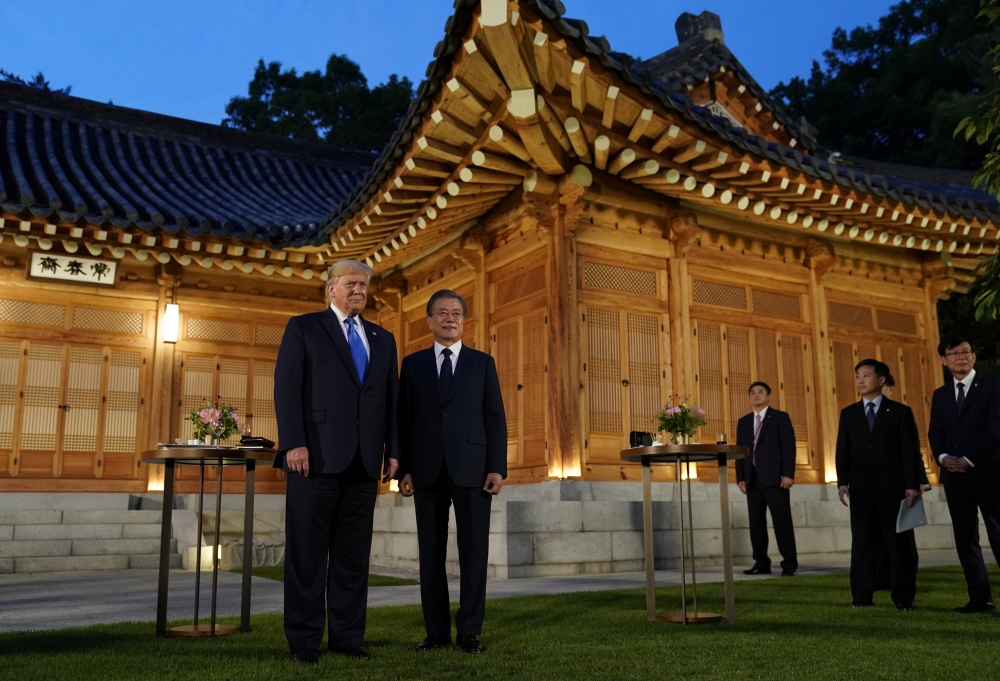 South Korea's President Moon Jae-in and U.S. President Donald Trump pose for a picture before a dinner at the Presidential Blue House in Seoul, South Korea, June 29, 2019. REUTERS/Kevin Lamarque