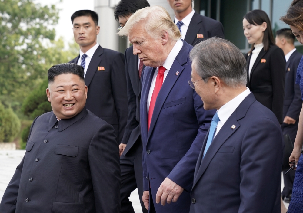 U.S. President Donald Trump, North Korean leader Kim Jong Un and South Korean President Moon Jae-in leave after a meeting at the demilitarized zone separating the two Koreas, in Panmunjom, South Korea, June 30, 2019. REUTERS/Kevin Lamarque
