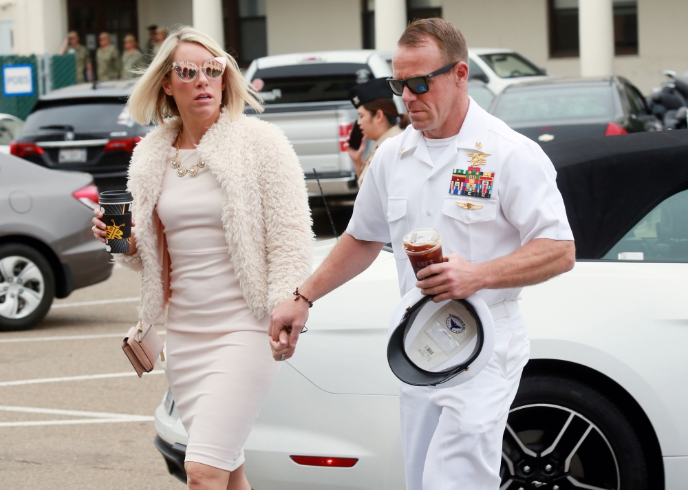 Navy Special Operations Chief Edward Gallagher walks into military court with his wife Andrea Gallagher June 24, 2019 in San Diego, California. Chief Gallagher is on trial for war crimes for shooting of unarmed civilians in Iraq in 2017, including a schoo