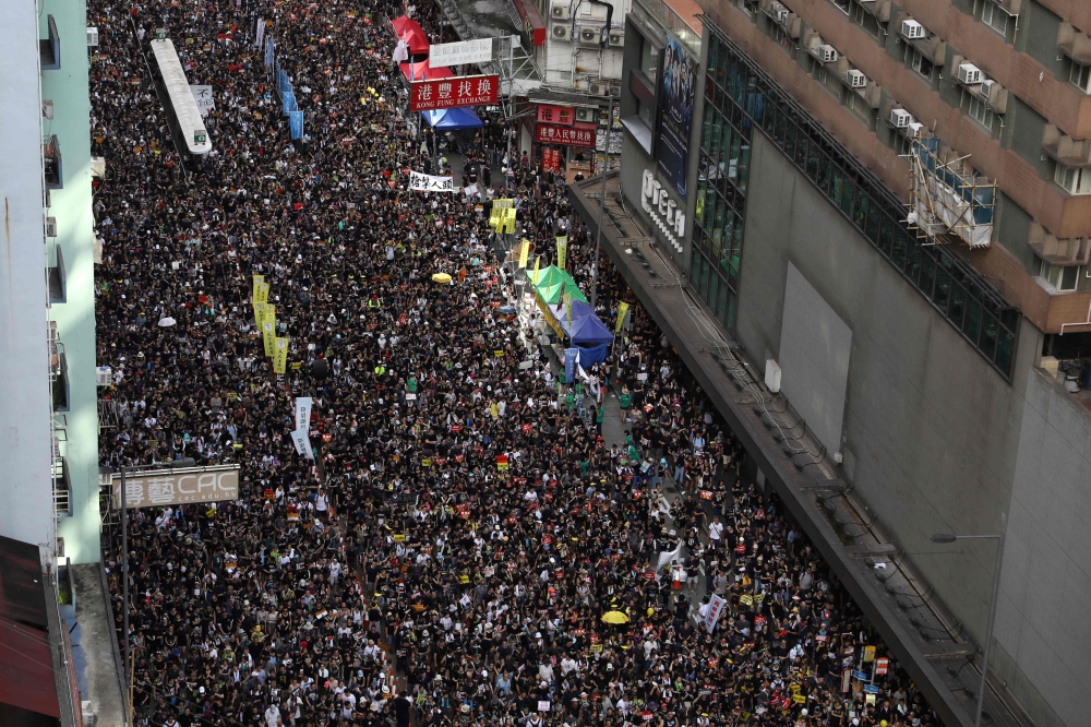 Protesters attend the annual pro-democracy rally in Hong Kong on July 1, 2019, on the 22nd anniversary of the city's handover from Britain to China. AFP / Dale De La Rey
