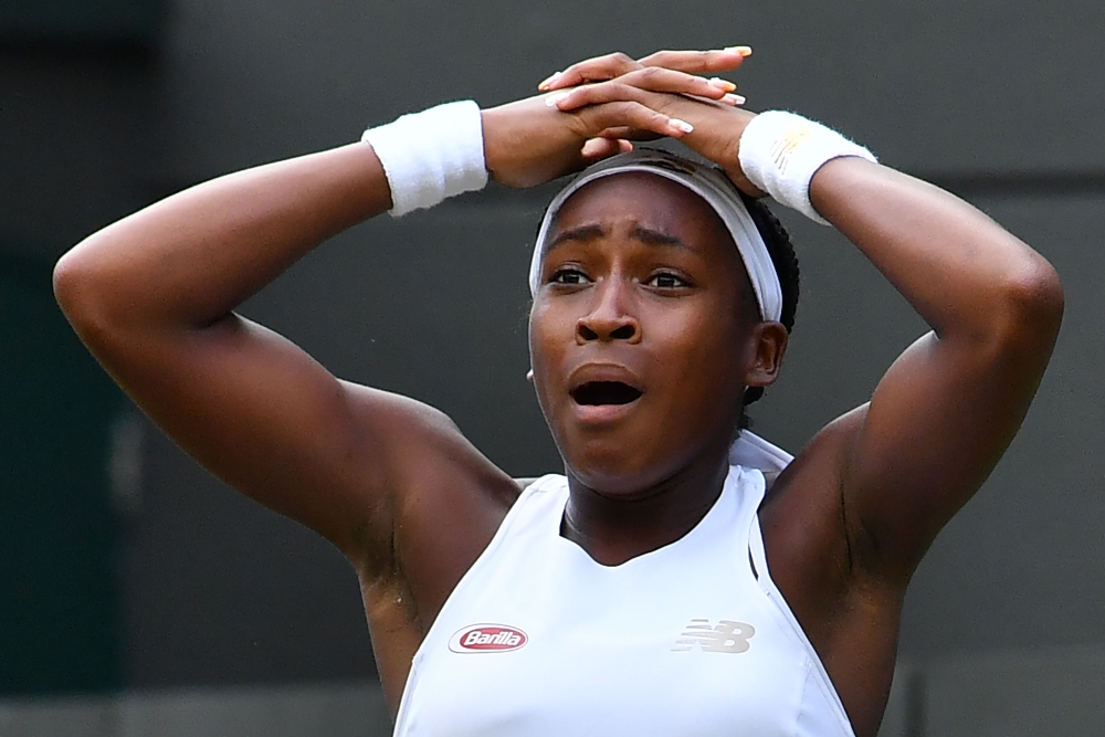 US player Cori Gauff celebrates beating US player Venus Williams during their women's singles first round match on the first day of the 2019 Wimbledon Championships at The All England Lawn Tennis Club in Wimbledon, southwest London, on July 1, 2019. AFP /