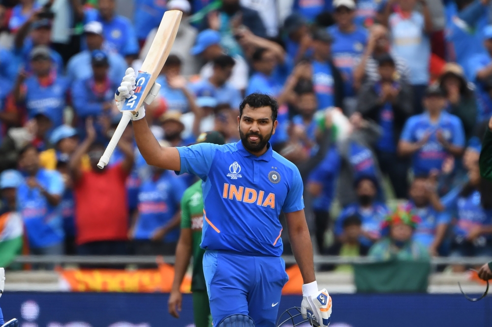 India's Rohit Sharma celebrates making his century during the 2019 Cricket World Cup group stage match between Bangladesh and India at Edgbaston in Birmingham, central England, on July 2, 2019. AFP / Paul Ellis