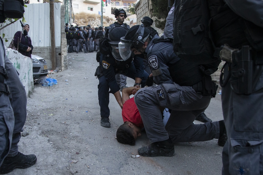 Israeli forces are seen trying to take some Palestinians into custody after tension risen between Israeli forces and Palestinians, following the funeral ceremony of Palestinian youth Mohammad Samir, 20, who was shot with live ammunition in the heart and t