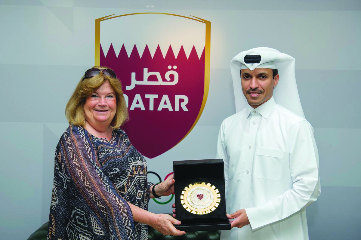 The Secretary-General of the Association of National Olympic Committees, Gunilla Lindberg receiving a memento from Secretary-General of Qatar Olympic Committee, Jassim bin Rashid Al Buainain yesterday.