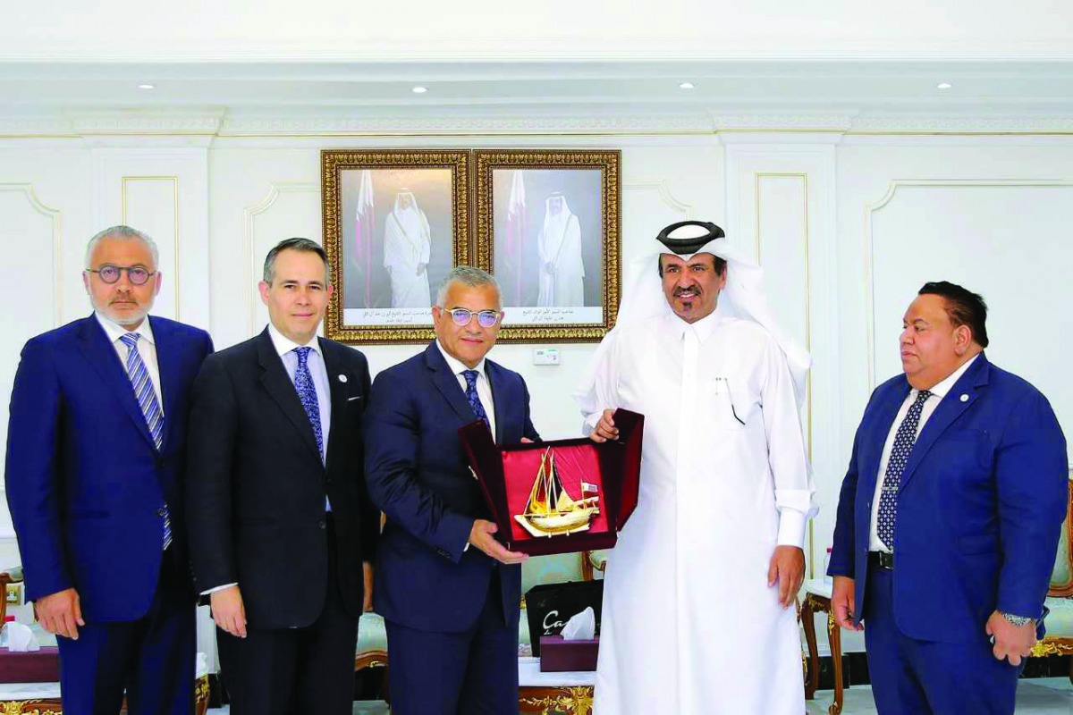 Mohammed bin Ahmed bin Towar Al Kuwari (second right), First Vice-Chairman of Qatar Chamber, handing a memento to the visiting Vice-Minister for Economic Affairs and Relations with the Dominican Community Abroad, Dr Carlos Gabriel Garcia, at QC headquarte