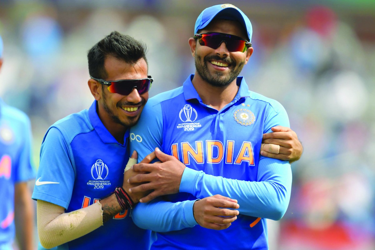 India's Ravindra Jadeja (L) shares a light moment at the end of the first innings during the 2019 Cricket World Cup first semi-final between New Zealand and India at Old Trafford in Manchester, northwest England, on July 10, 2019. AFP / Dibyangshu Sarkar