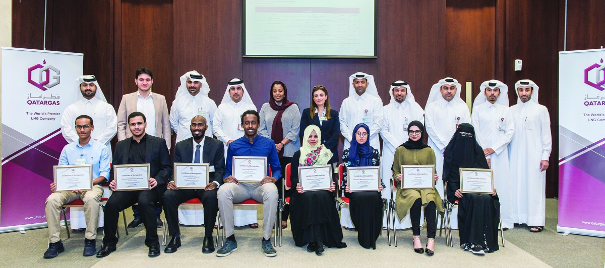 Qatargas and Qatar University officials with members of the winning team at the Plant Design Competition. 