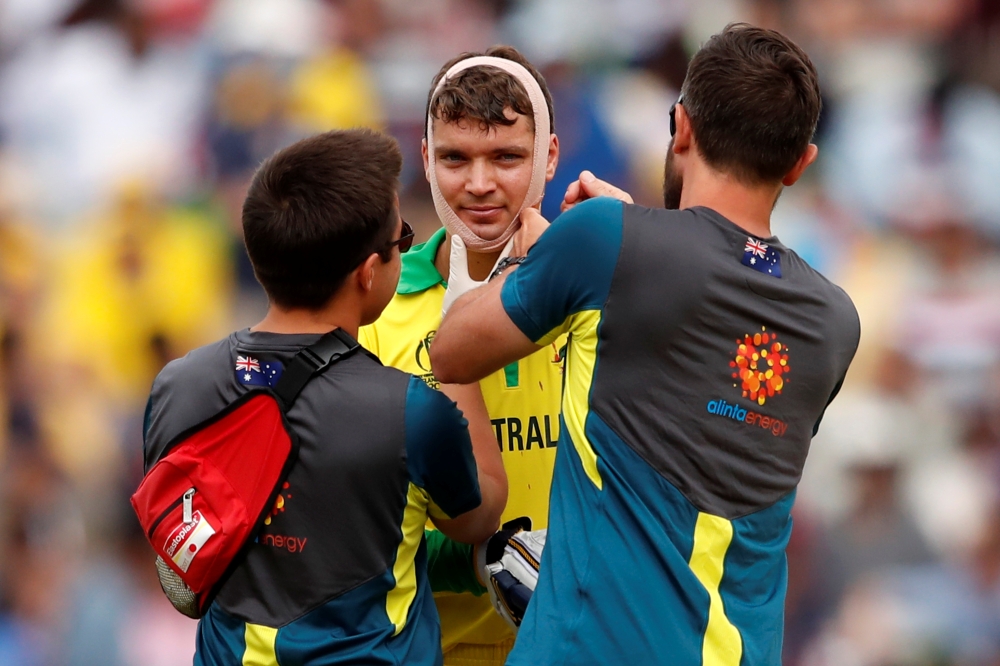 Australia's Alex Carey is wrapped in a bandage after sustaining an injury earlier in the match Action Images via Reuters/Andrew Boyers