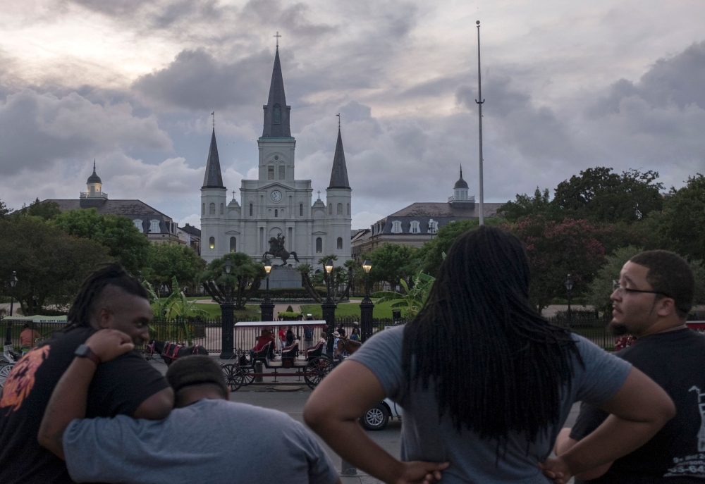 Storm clouds pass over Saint Louis Cathedral in New Orleans, Louisana on July 11, 2019, as tropical storm Barry approaches. Tropical storm Barry barreled toward rain-soaked New Orleans on July 11 as the city hunkered down for an ordeal that evoked fearful