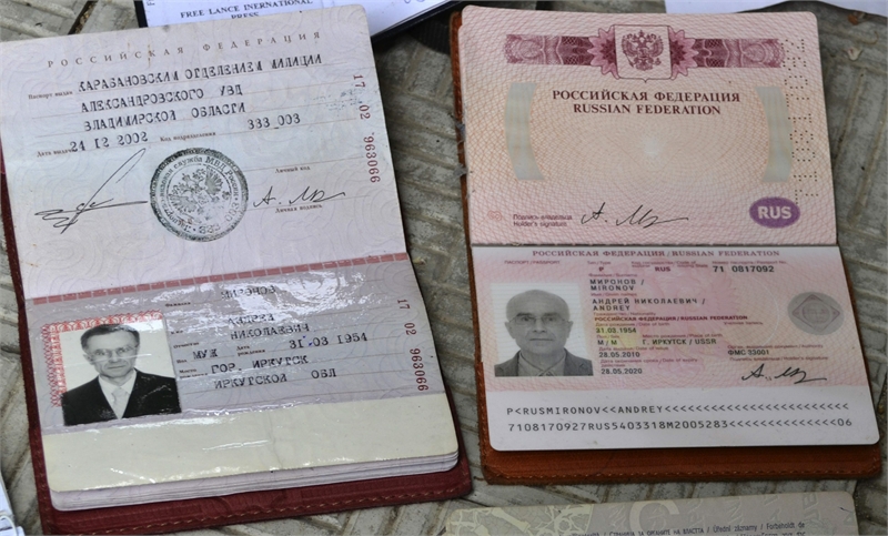 Domestic and foreign passports of Russian Andrey Mironov, and a passport of Italian photojournalist Andrea Rocchelli lie on display in Slaiansk, Ukraine. (Photo courtesy: cyprus-mail.com )  