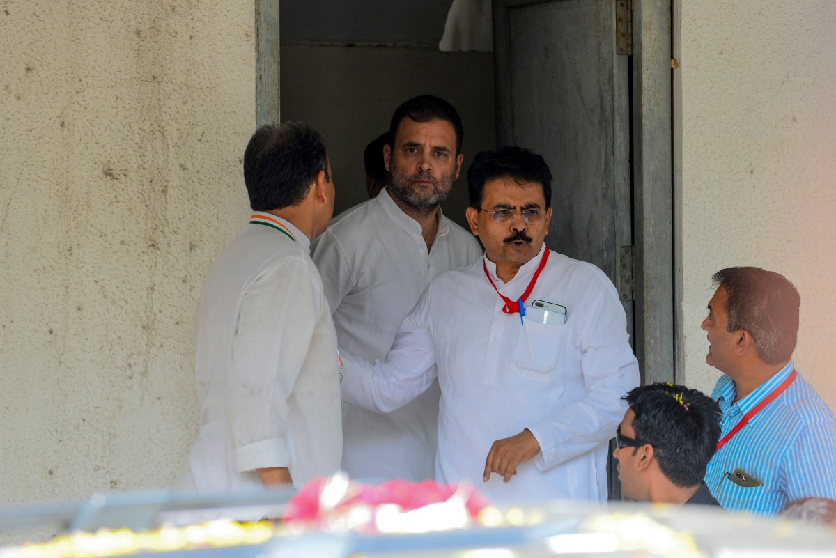Former Congress President Rahul Gandhi (C) comes out of the Metropolitan Court premises in Ahmedabad on July 12, 2019. AFP / Sam Panthaky
