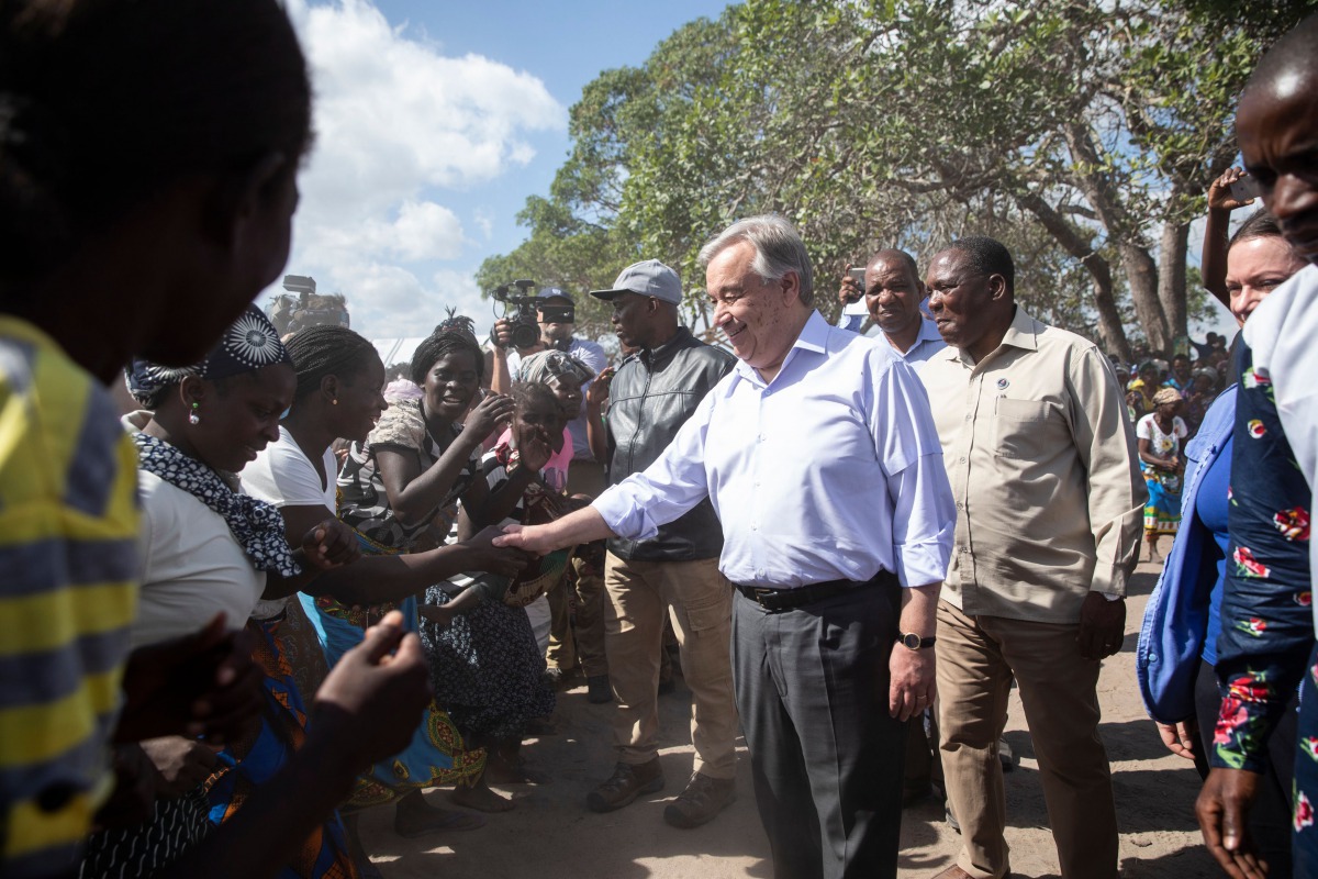 Antonio Guterres, the United Nations Secretary General, greets people at the Mandruzi Resettlement area on July 12, 2019 in Dondo District, as part of Guterres' visit to assess recovery efforts from two cyclones earlier this year in Mozambique. AFP / Wiku