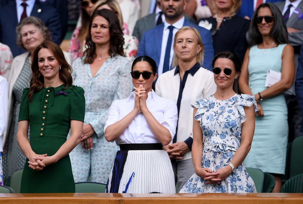 Britain's Catherine, Duchess of Cambridge, with Meghan, Duchess of Sussex, in the Royal Box after the final between Serena Williams of the U.S. and Romania's Simona Halep Laurence Griffiths/Pool via REUTERS