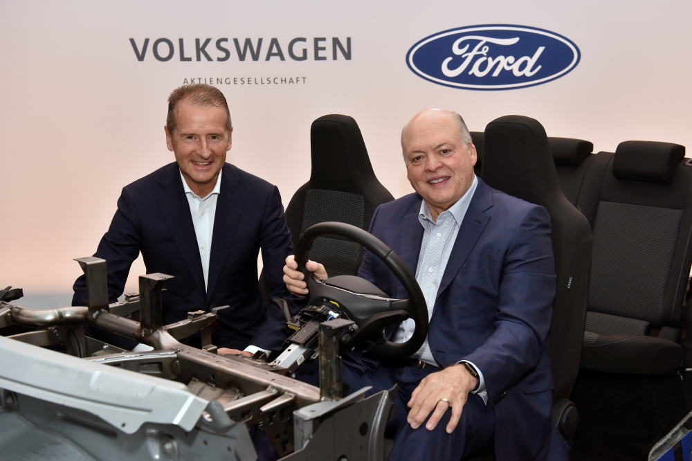 Volkswagen CEO Herbert Diess and Ford President and CEO Jim Hackett appear in a prototype vehicle after announcing a joint investment in Argo, a self-driving autonomous vehicle company in New York City, New York, U.S. July 12, 2019. Sam VarnHagen/via Reut