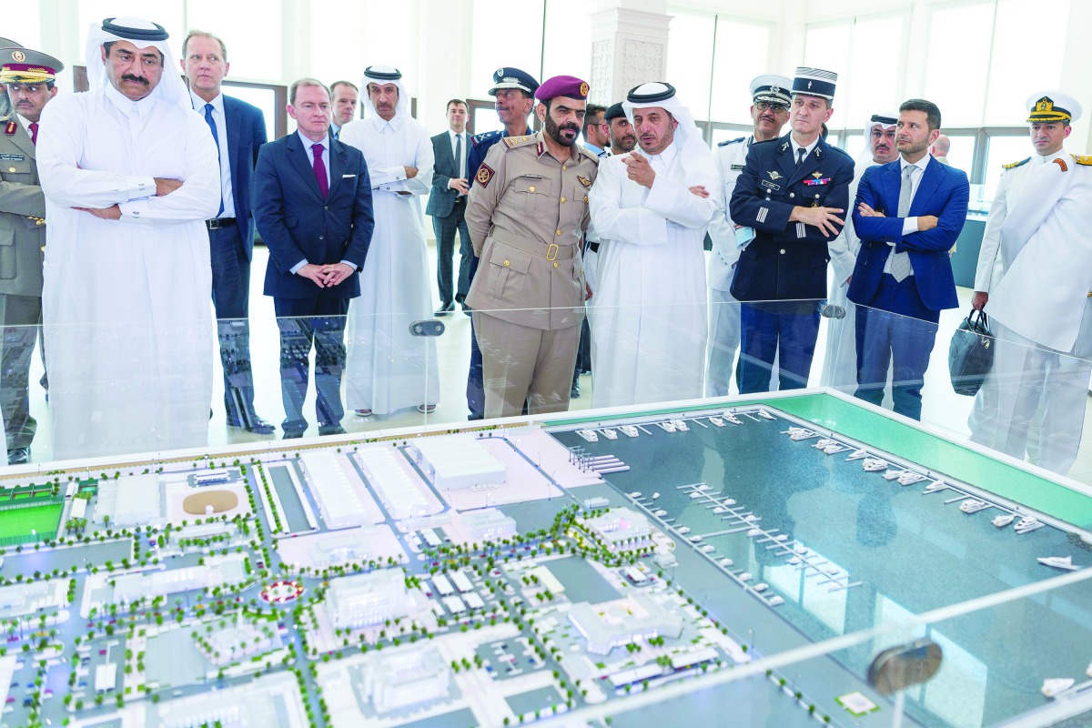 Prime Minister and Interior Minister H E Sheikh Abdullah bin Nasser bin Khalifa Al Thani takes a look at the miniature version of the Al Daayen Naval Base, the new building of the General Directorate of Coasts and Borders Security, in Semaisma area in nor