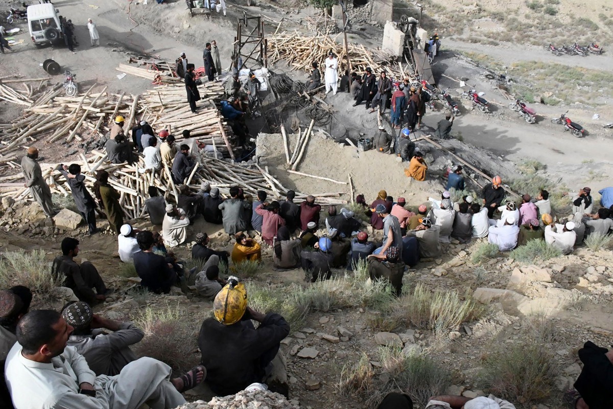 Pakistani miners gather outside the collapsed mine some 35 kilometres east of Quetta, the capital of oil and mineral rich Balochistan province on July 15, 2019. AFP