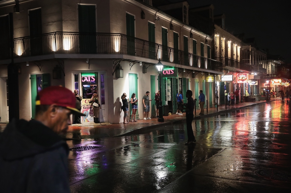 Visitors check out the attractions along Bourbon Street in the French Quarter despite rainfall from Hurricane Barry on July 12, 2019 in New Orleans, Louisiana. Scott Olson/Getty Images/AFP 