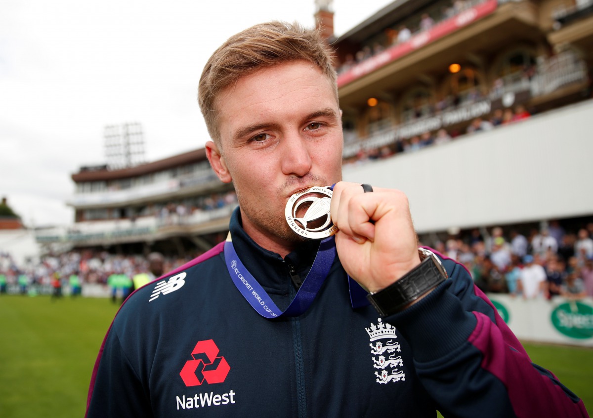 England's Jason Roy with his medal during the celebrations (Action Images via Reuters/Andrew Boyers) 
