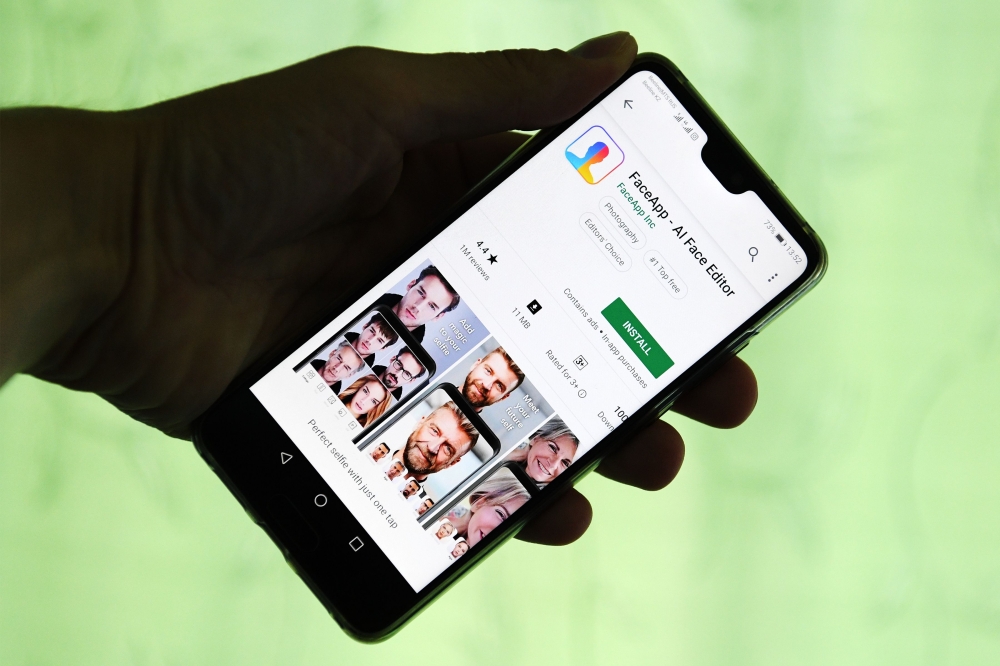 This illustration picture shows FaceApp application displayed on the screen of a smartphone. AFP / Kirill Kudryavtsev 
