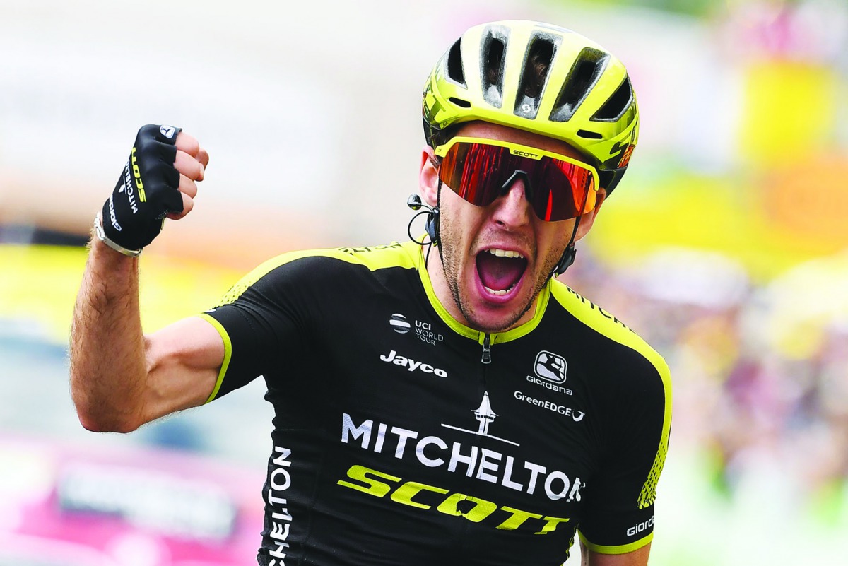 Great Britain's Simon Yates celebrates as he wins on the finish line of the twelfth stage of the 106th edition of the Tour de France cycling race between Toulouse and Bagneres-de-Bigorre, in Bagneres-de-Bigorre on July 18, 2019. AFP / Anne-Christine Poujo