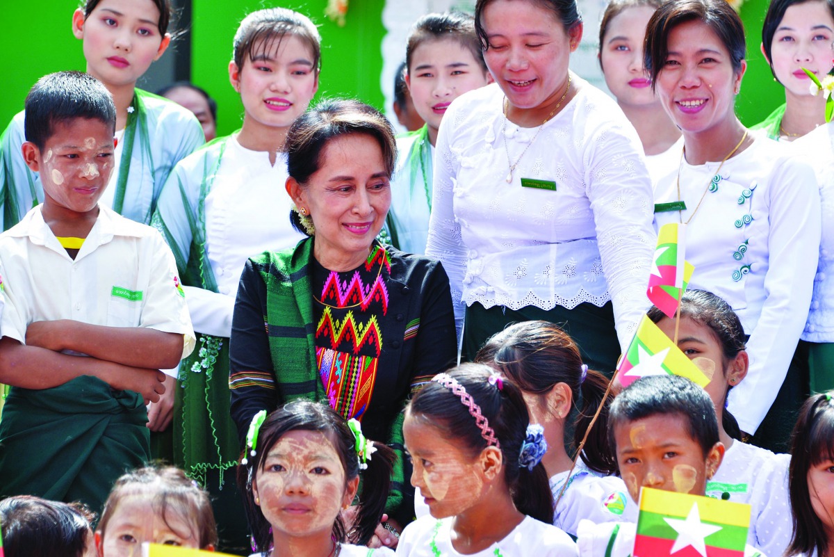 Myanmar's State Counsellor Aung San Suu Kyi attends a ceremony with teachers and students for a new school in Kawhmu on July 18, 2019. AFP 
