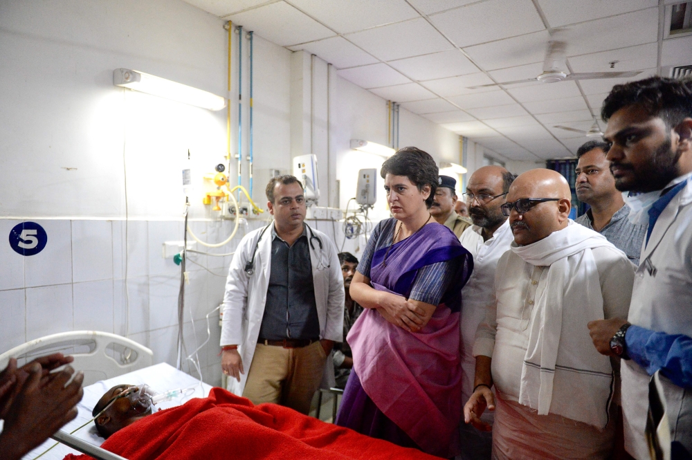 Priyanka Gandhi Vadra (2L) meets Sonbhadra massacre victims at the Banaras Hindu University  Trauma Centre in Varanasi July 19, 2019. AFP/ All India Congress Committee 