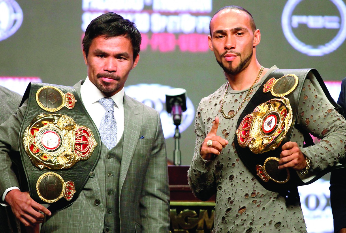 Philippine boxer Manny Pacquiao (L) and US boxer Keith Thurman pose as they hold their final press conference at the MGM Grand Hotel & Casino on July 17, 2019 in Las Vegas, Nevada, ahead of their July 20th WBC welterweight fight.  AFP / John Gurzinski