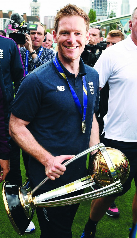 Morgan holds the trophy as he attends a World Cup victory event at The Oval in London on July 15, 2019, a day after they won the 2019 Cricket World Cup final against New Zealand. 