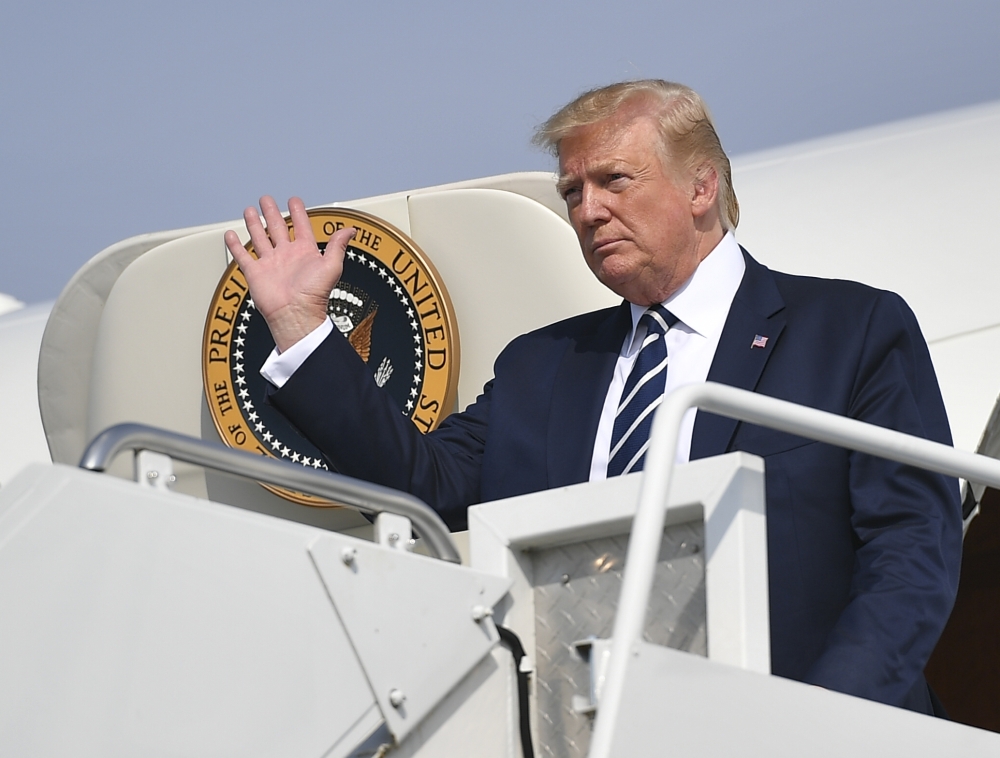 US President Donald Trump steps off Air Force One upon arrival at Morristown Municipal Airport in Morristown, New Jersey en route Bedminster, New Jersey on July 19, 2019. Trump is heading to his golf resort in Bedminster, New Jersey to attend a fundraiser