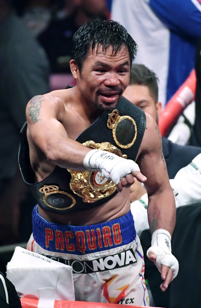 Manny Pacquiao celebrates his split-decision victory over Keith Thurman in their WBA welterweight title fight at MGM Grand Garden Arena on July 20, 2019 in Las Vegas, Nevada. Ethan Miller/Getty Images/AFP