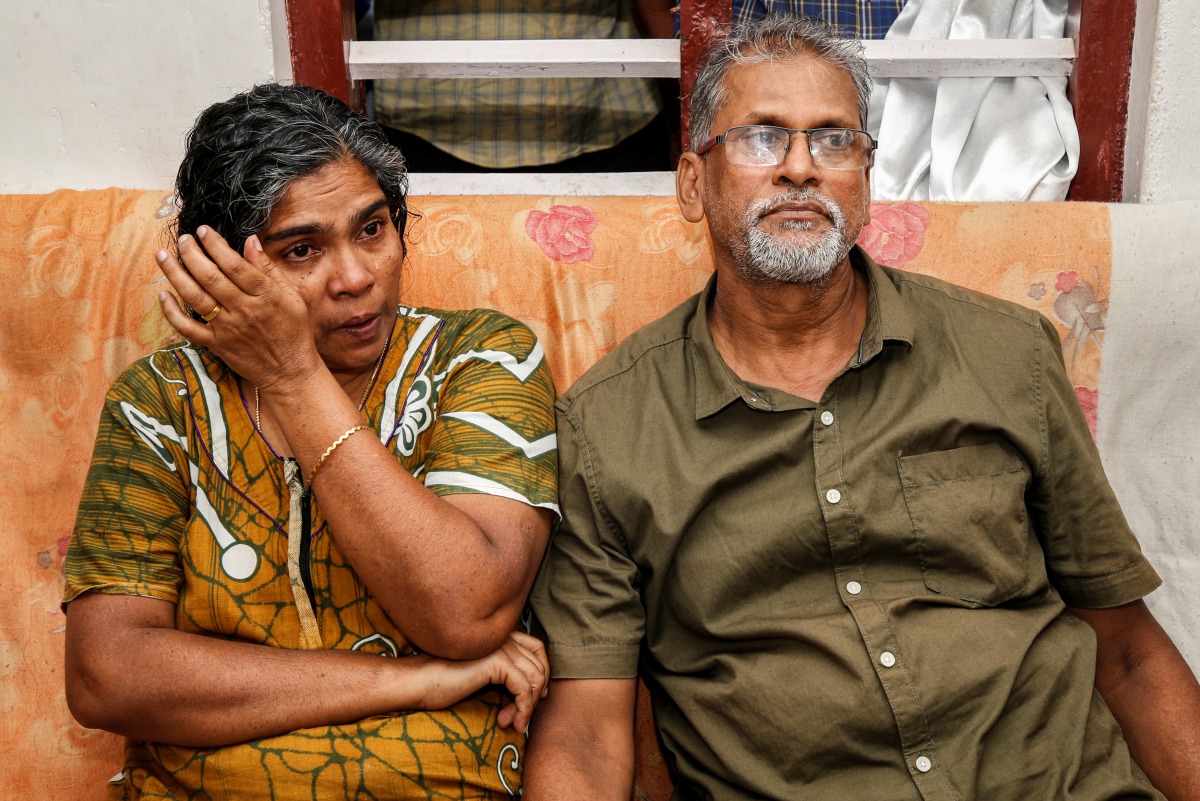 Deena with her husband Pappachan T V, parents of Dijo Pappachan, one of the crew members of British-flagged vessel owned by Stena Bulk, seized by Iran, cries as she watches television news at their home in Kochi, India, July 21, 2019.  Reuters/Sivaram V 