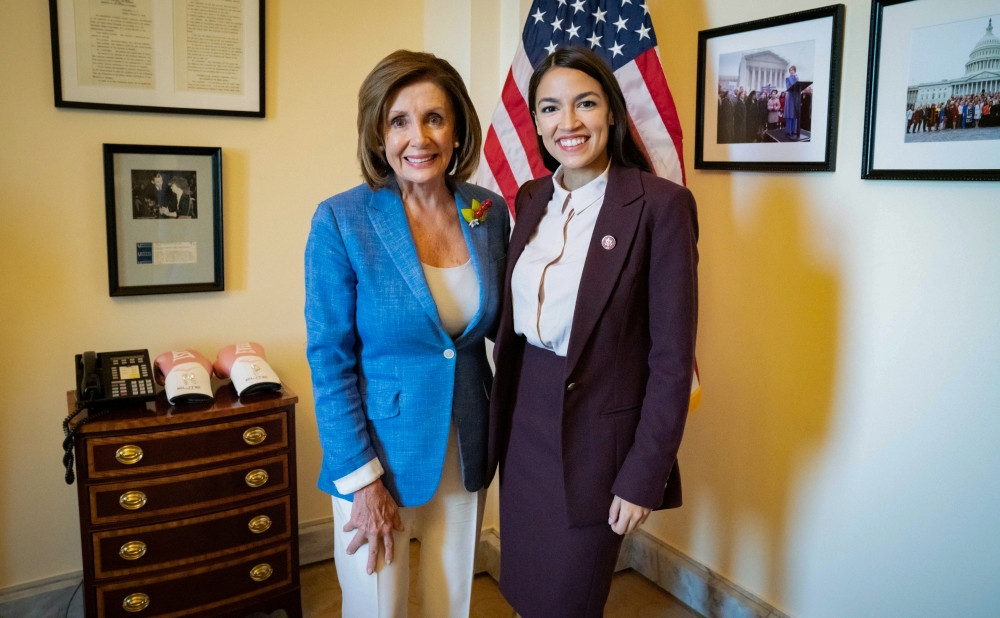 US Speaker of the House Nancy Pelosi poses with Rep. Alexandria Ocasio-Cortez in a photo released by her office after they met in the Speaker's office at the US Capitol in Washington, U.S. July 26, 2019. (Office of House Speaker Nancy Pelosi/via REUTERS)