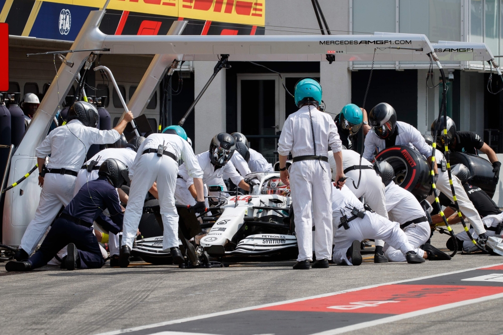 ercedes' British driver Lewis Hamilton sits inside his car in the pit stop during the qualifying session of the German Formula One Grand Prix at the Hockenheim racing circuit on July 27, 2019 in Hockenheim, southern Germany. (AFP / POOL / VALDRIN XHEMAJ)