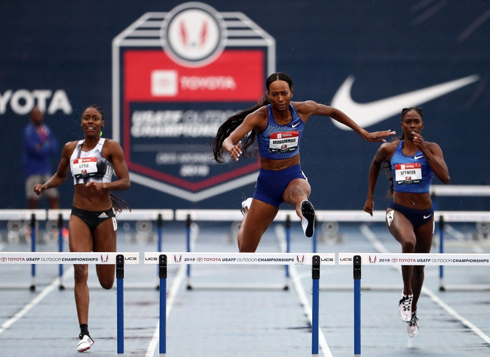 Dalilah Muhammad clears the last hurdle on her way toward winning the Women's 400 Meter Hurdles and setting a new World Record of 52.20 during the 2019 USATF Outdoor Championships at Drake Stadium on July 27, 2019 in Des Moines, Iowa. (Jamie Squire/Getty 