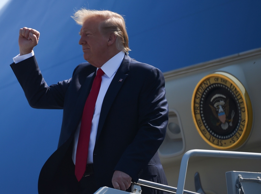 US President Donald Trump arrives in Newport News, Virginia on July 30, 2019, before departing for Jamestown, Virginia to give remarks at the 400th Anniversary of the First Representative Legislative Assembly. (AFP / Andrew CABALLERO-REYNOLDS)