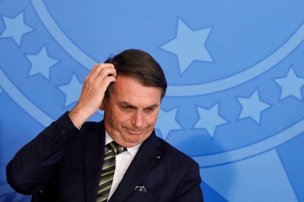 Brazil's President Jair Bolsonaro gestures during a review and modernization ceremony of occupational health and safety work at the Planalto Palace in Brasilia, Brazil July 30, 2019. (REUTERS/Adriano Machado)