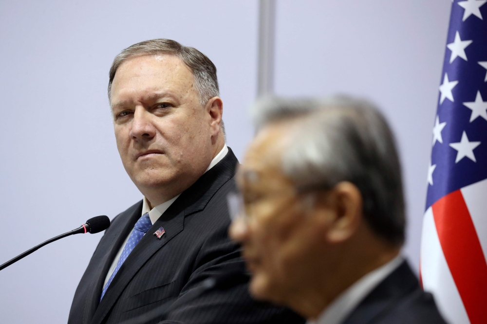 US Secretary of State Mike Pompeo (L) listens as Thailand's Foreign Minister Don Pramudwinai speaks during a press conference at the Association of Southeast Asian Nations (ASEAN) Foreign Ministers' Meeting in Bangkok on August 1, 2019. / AFP / POOL / JON