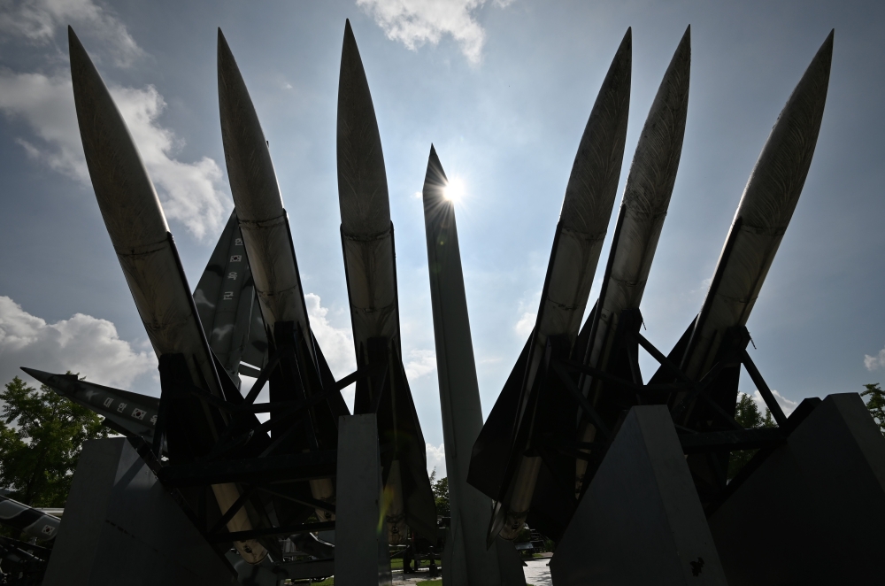 A replica of a North Korean Scud-B missile (C) and South Korean Hawk surface-to-air missiles are displayed at the Korean War Memorial in Seoul on August 2, 2019. North Korea has fired unidentified short-range projectiles, the South Korean news agency Yonh