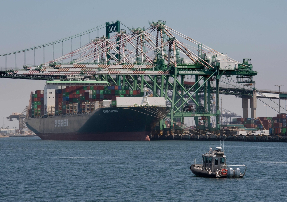 A container ship unloads it's cargo from Asia, at the Long Beach port, California on August 1, 2019. President Donald Trump announced August 1 that he will hit China with punitive tariffs on another $300 billion in goods, escalating the trade war after ac